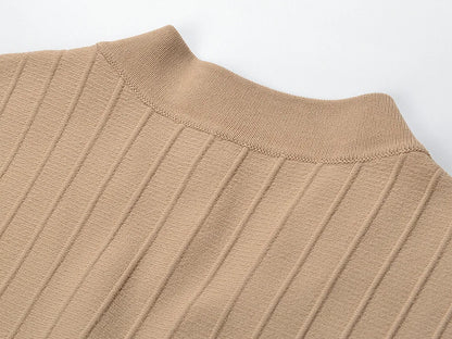 Close-up of the neckline detail on a V-neck sleeveless fall dress for women in a beige ribbed fabric