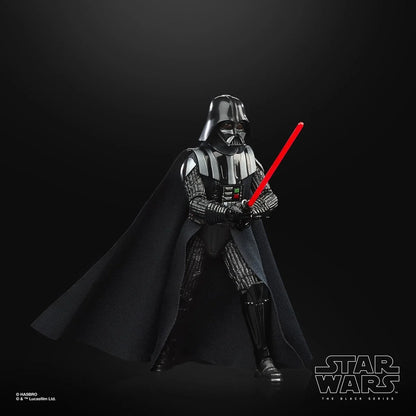 Darth Vader black action figure with red lightsaber and cape posed on dark background Star Wars action figures for collectors