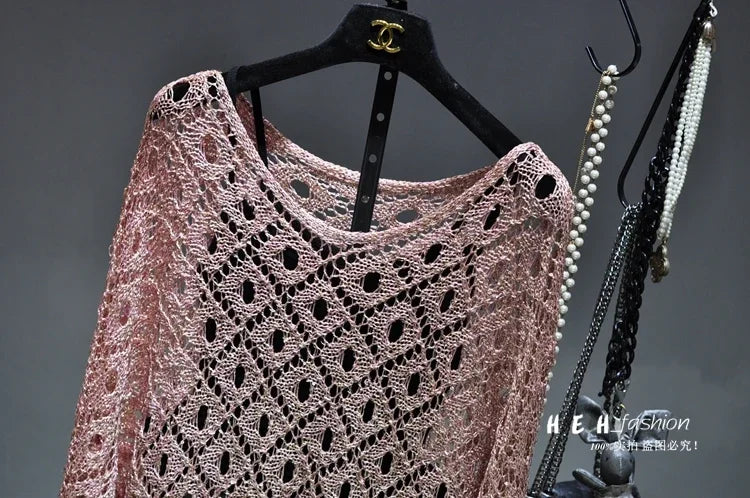 Light pink metallic lace knit dress on black hanger with pearl necklaces fall sequin dresses for women