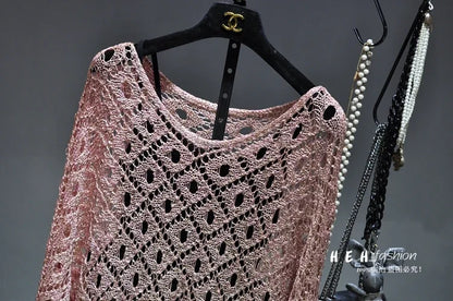Light pink metallic lace knit dress on black hanger with pearl necklaces fall sequin dresses for women