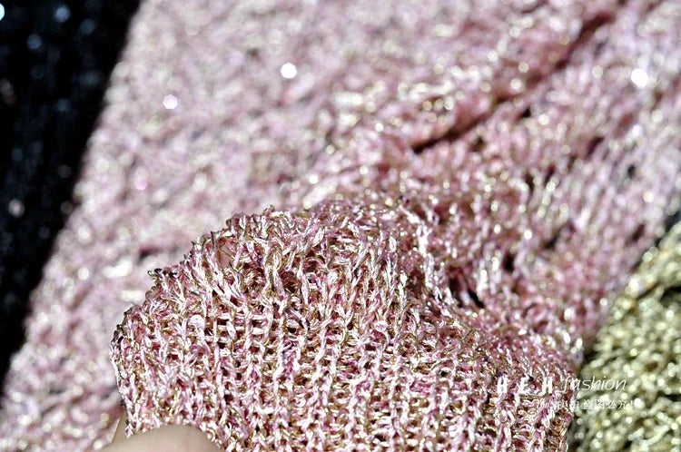 Close up of pink metallic sequin knit fabric swatch showcasing shimmer texture for fall sequin dresses for women