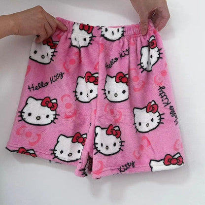 Soft pink Hello Kitty anime pajama pants featuring cute cat prints and an elastic waistband