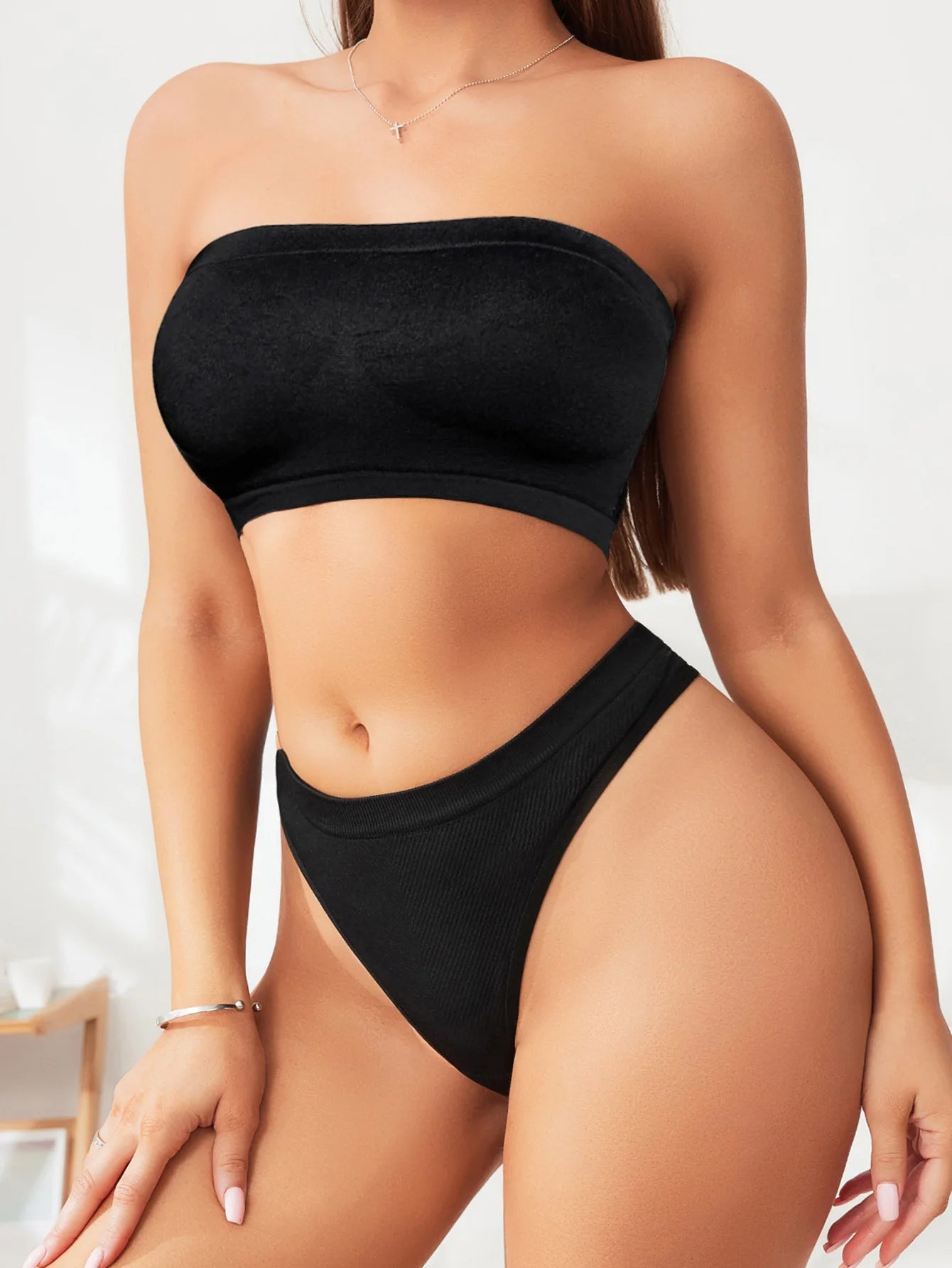 EtherealBe versatile wrap-around bra in black, designed for comfort and style with a smooth finish.