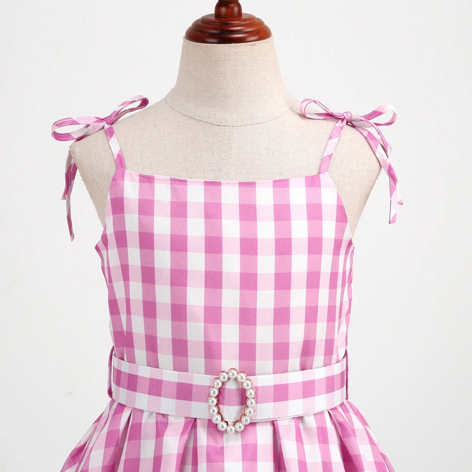 Pink gingham sundress with tie shoulder straps and pearl buckle belt on mannequin pink cowgirl cosplay set for kids by EtherealBe
