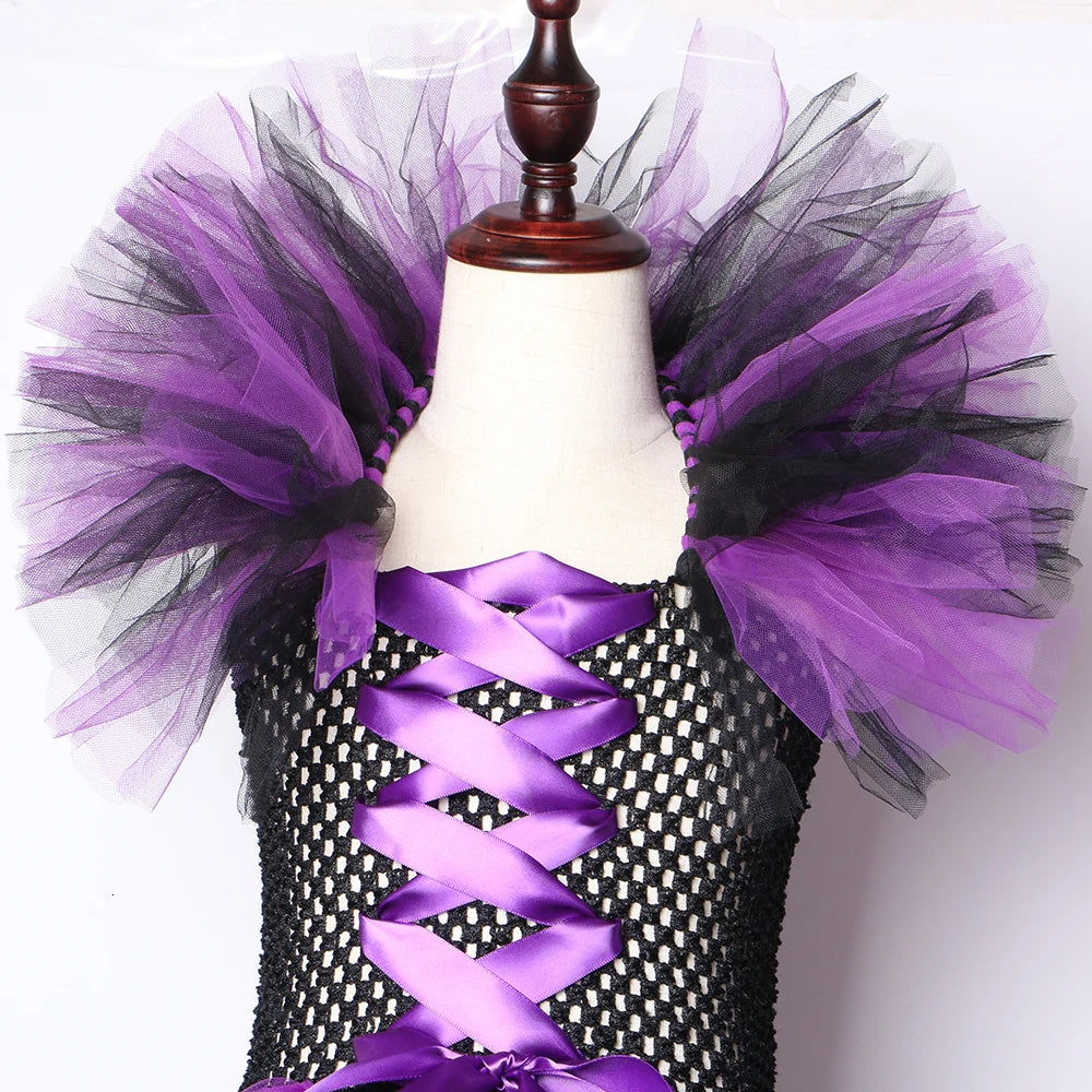 Girls purple and black kids witch tutu costume with hat featuring a fluffy tulle design and ribbon accents