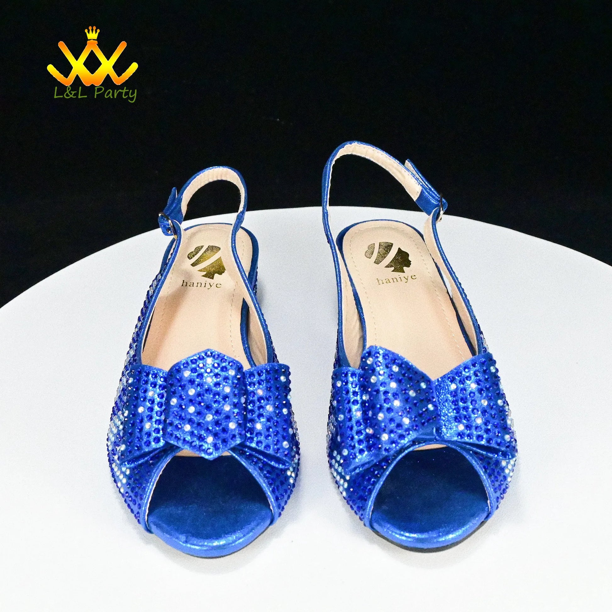 EtherealBe blue jeweled slingback open toe heels with bow embellishment Fashionable shoes and bag set.