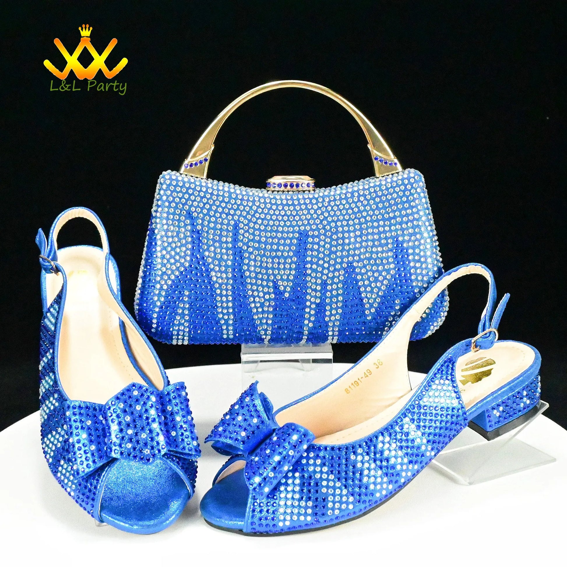 Fashionable shoes and bag set. Blue rhinestone slingback low heel bow shoes with matching crystal handbag and gold handle