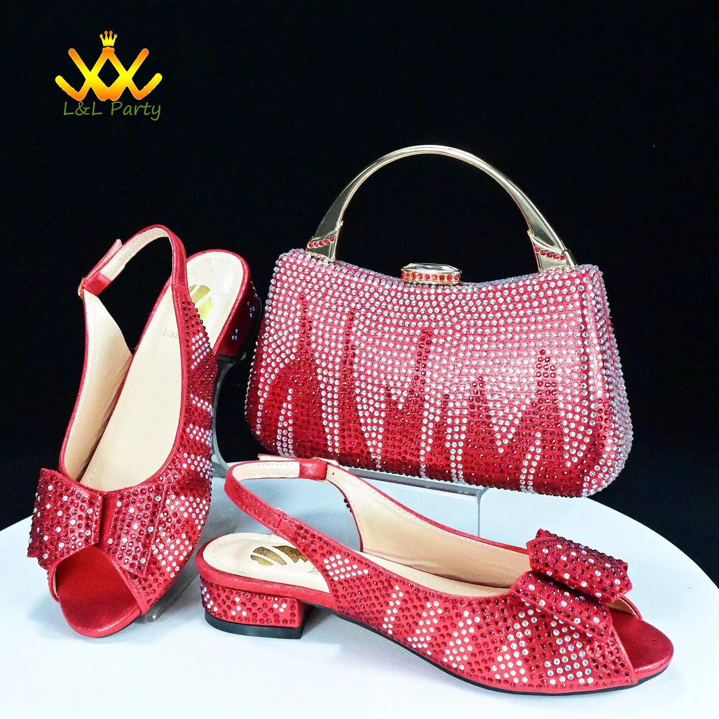 Red crystal studded slingback peep toe shoes with bow and matching red clutch with gold handle Fashionable shoes and bag set.