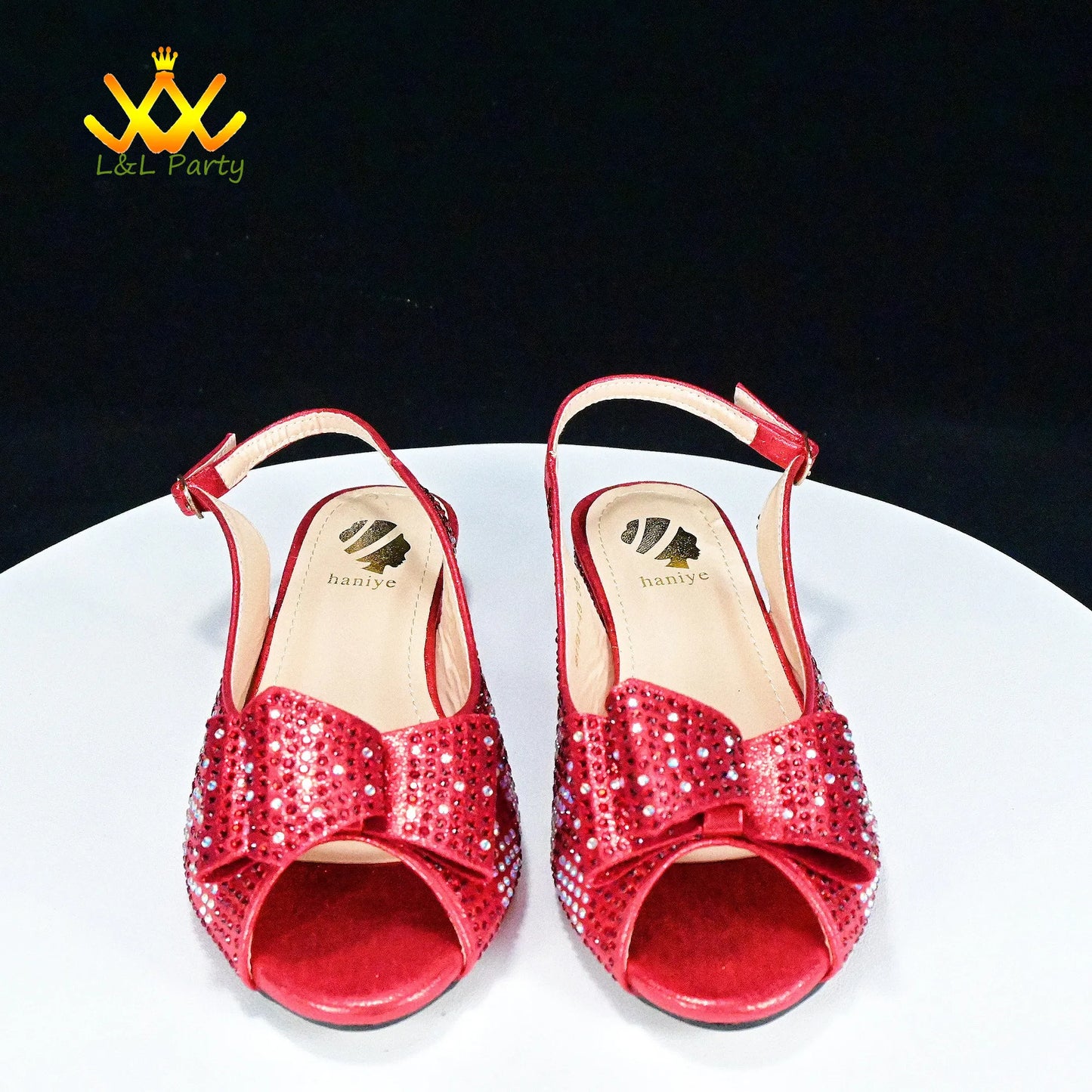 Red rhinestone slingback peep toe sandals on white display by EtherealBe Fashionable shoes and bag set.
