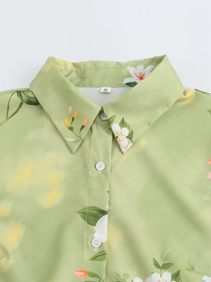 Close-up of the collar and floral pattern on a long sleeve spring floral midi dress in green
