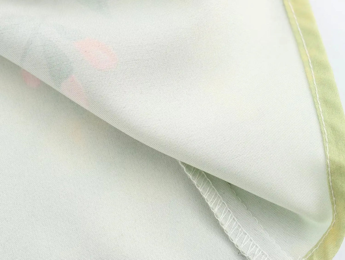 Detail of the fabric showing soft texture of the long sleeve spring floral midi dress