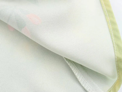 Detail of the fabric showing soft texture of the long sleeve spring floral midi dress