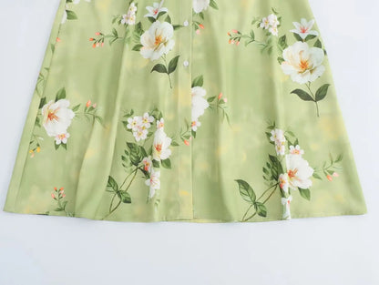 Light green long sleeve spring floral midi dress with beautiful flower patterns and button details