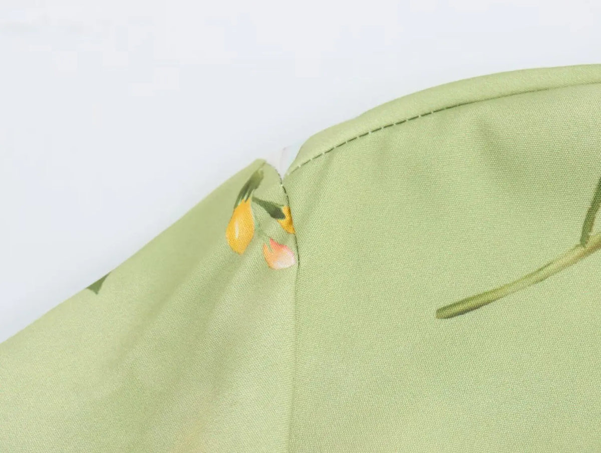 Detail of the long sleeve spring floral midi dress featuring soft fabric and vibrant floral patterns
