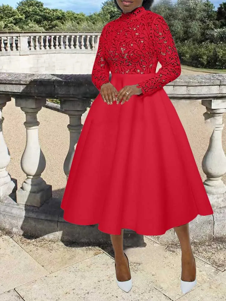 Red midi dress with high neck lace bodice and full skirt on model by stone balustrade elegant lace party dress for women