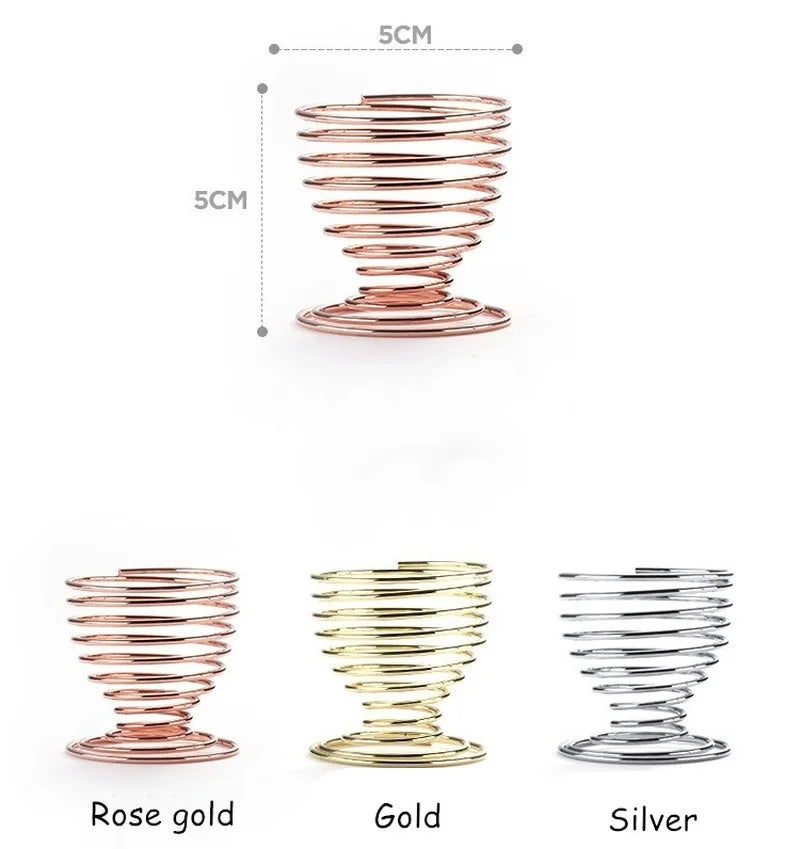 Metal makeup sponge holder in rose gold, gold, and silver colors with a spiral design for stylish storage