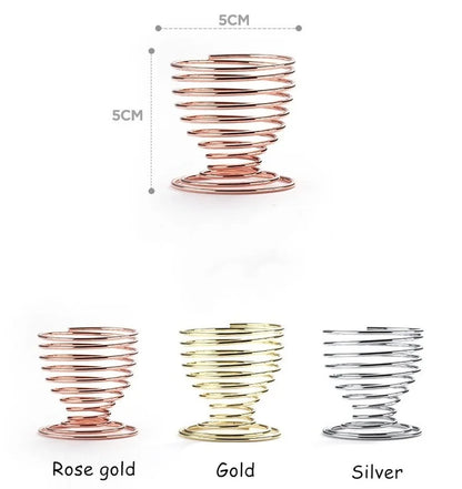 Metal makeup sponge holder in rose gold, gold, and silver colors with a spiral design for stylish storage