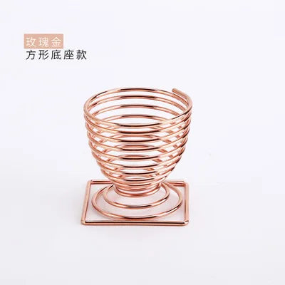 EtherealBe stylish rose gold makeup sponge holder with a spiral design for easy storage