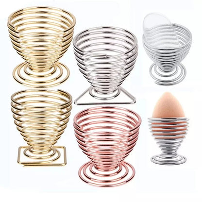 Set of stylish makeup sponge holders in gold, silver, and rose gold for organized beauty tools