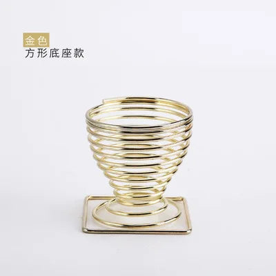 Stylish gold wire makeup sponge holder designed for storing and displaying beauty sponges