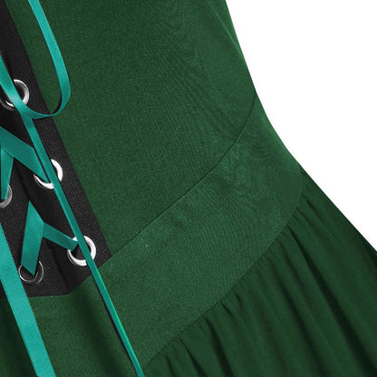 Close-up of a medieval Gothic witch costume with green fabric and lace-up details