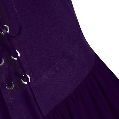 Close-up of a medieval Gothic witch costume with lace up details and rich purple fabric