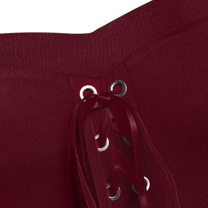 Detailed close-up of the lace-up design on a medieval Gothic witch costume in deep burgundy