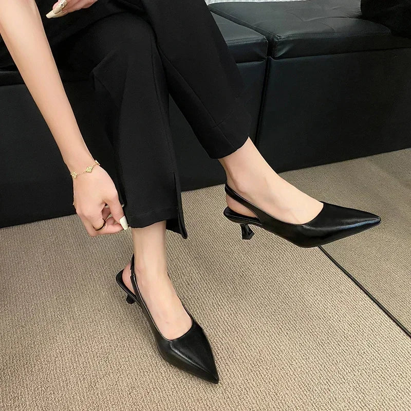 Elegant black mid heel pointed toe slingback shoes for stylish women in versatile outfits