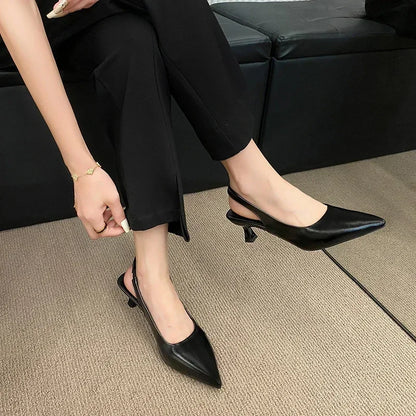 Elegant black mid heel pointed toe slingback shoes for stylish women in versatile outfits