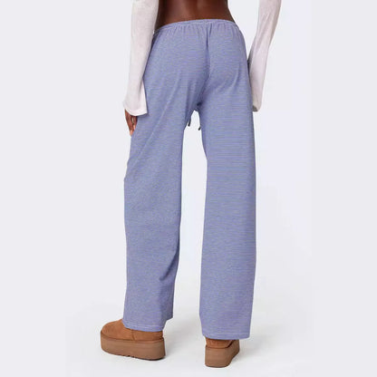 Back view of EtherealBe milk silk casual pants for women in blue stripes with elastic waistband
