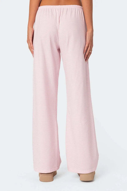 Back view of EtherealBe milk silk casual pants for women in light pink with a relaxed fit