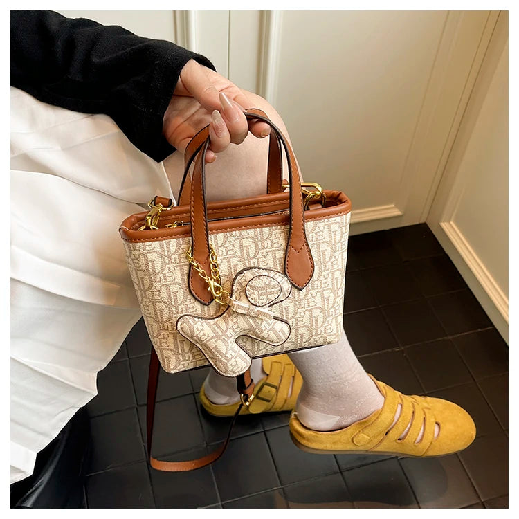 EtherealBe multi pocket women's everyday tote in cream with a cute teddy charm and stylish straps