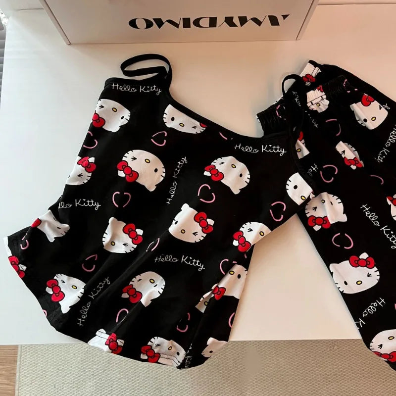 Black Hello Kitty pajama set for women featuring printed camisole with ruffle hem and drawstring pants