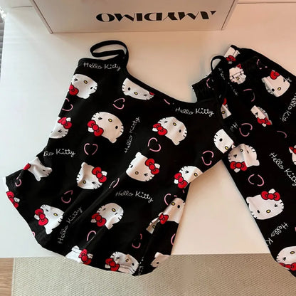 Black Hello Kitty pajama set for women featuring printed camisole with ruffle hem and drawstring pants