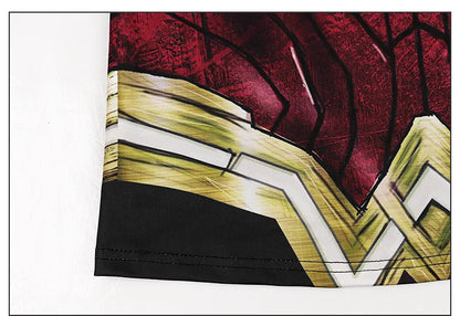 Close up of women superhero workout tank top hem showing red and gold emblem print and black trim