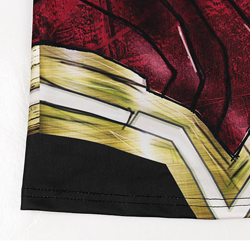 Close up printed hem of women superhero workout tank top showing red and gold armor graphic on black fabric