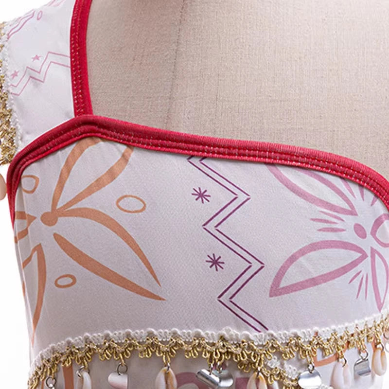 Disney Moana 2 Vaiana costume kids cosplay. Close up of girls printed bodice with red trim gold fringe and shell charms