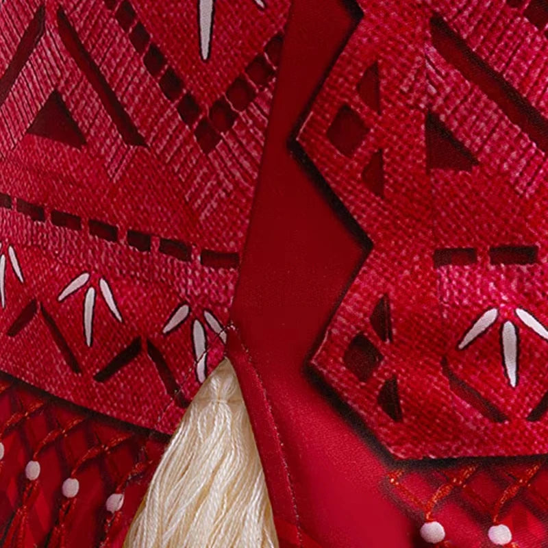 Disney Moana 2 Vaiana costume kids cosplay close up of red tribal patterned fabric with white tassel and bead details
