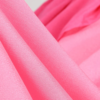 Close-up of soft pink fabric for peach princess Halloween costume for kids