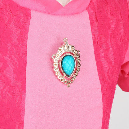 EtherealBe peach princess Halloween costume for kids featuring a jeweled brooch detail