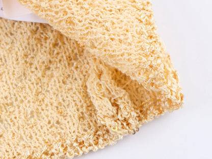 Close-up of a yellow pearl embellished knitted vest for women showcasing soft texture and elegant design