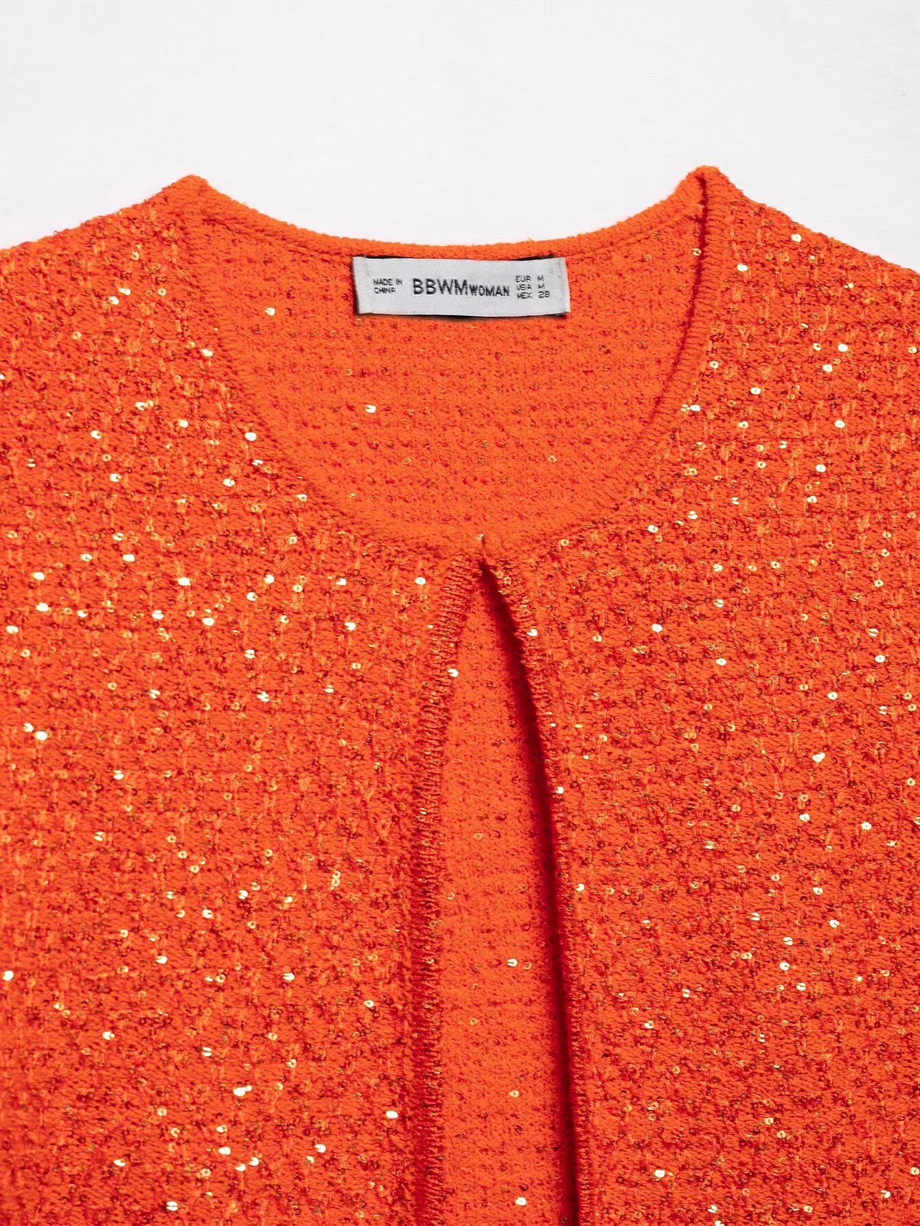 Bright orange pearl embellished knitted vest for women with a stylish open front design