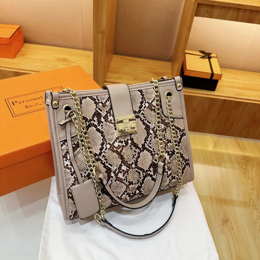 EtherealBe snake print leather shoulder bag with elegant chain strap and unique clasp design