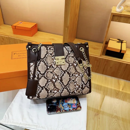 EtherealBe snake print leather shoulder bag with chain straps and stylish design