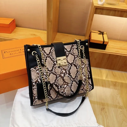 EtherealBe snake print leather shoulder bag with stylish chain and black accents
