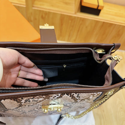 Inside view of the EtherealBe snake print leather shoulder bag with organized compartments and zipper pockets