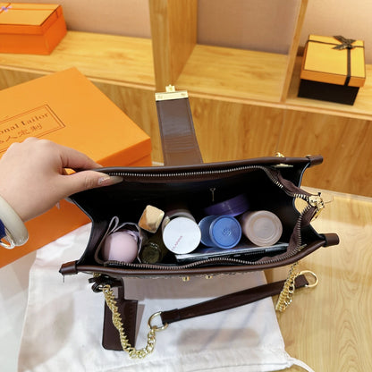 Inside view of an EtherealBe snake print leather shoulder bag showing organized cosmetics and essentials