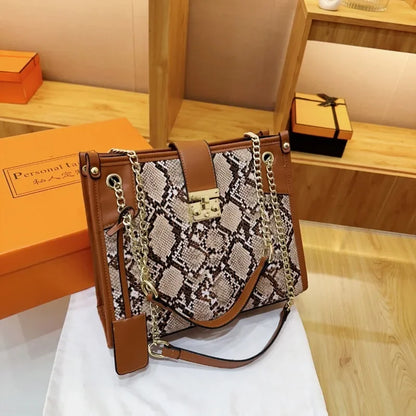 EtherealBe snake print leather shoulder bag with gold chain accents and a stylish design