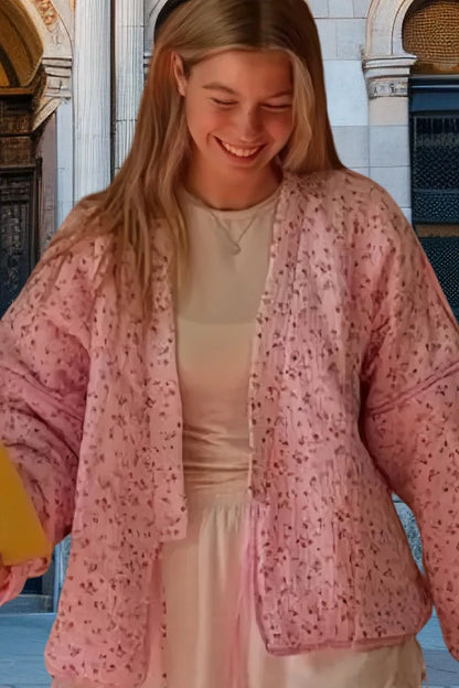 Model wearing a pink floral cotton jacket for women, featuring a relaxed fit and soft fabric