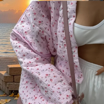 Stylish pink floral cotton jacket for women with a relaxed fit, perfect for casual outfits